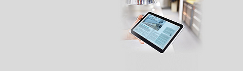 Die neueste Ausgabe von Report auf einem Tablet